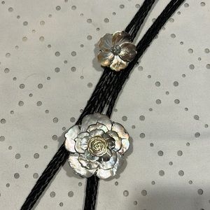 Lot of two black leather braided bolos with abalone flowers